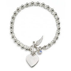 Pulsera Swaroski con Dijes de Ala y corazón Plata .925
