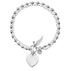Pulsera Swarovski con Dijes de Ala y corazón Plata .925