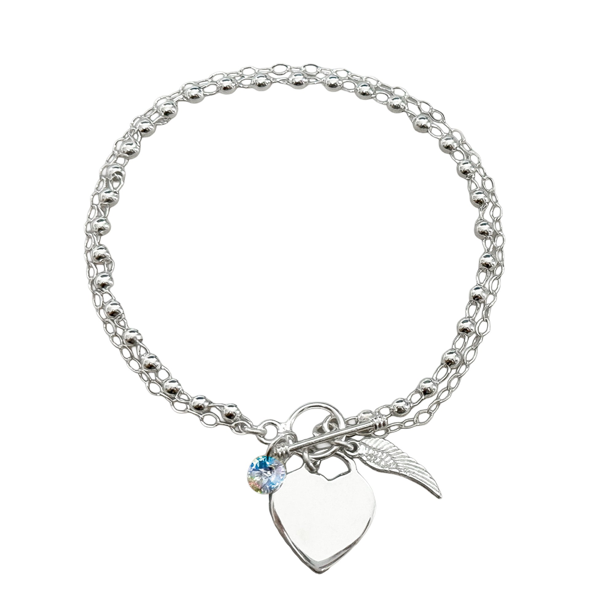 Pulsera Swarovski con Dijes de Ala y corazón Plata .925