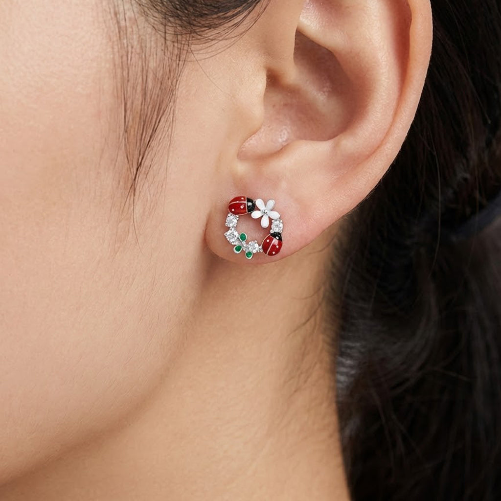 Arete Broquel Catarina y Flores Esmaltadas con Circonias Plata .925 con Baño de Rodio