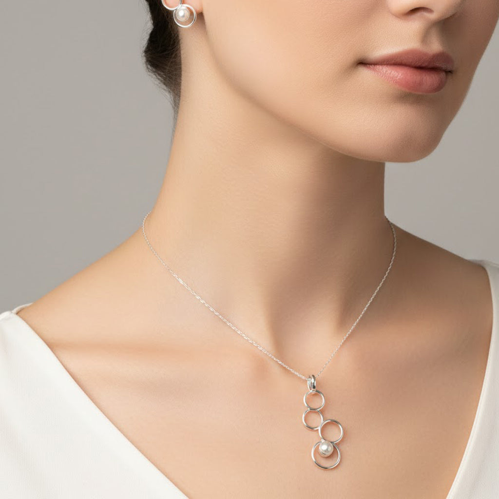 Juego Perla Natural con Siluetas de Círculos Plata .925