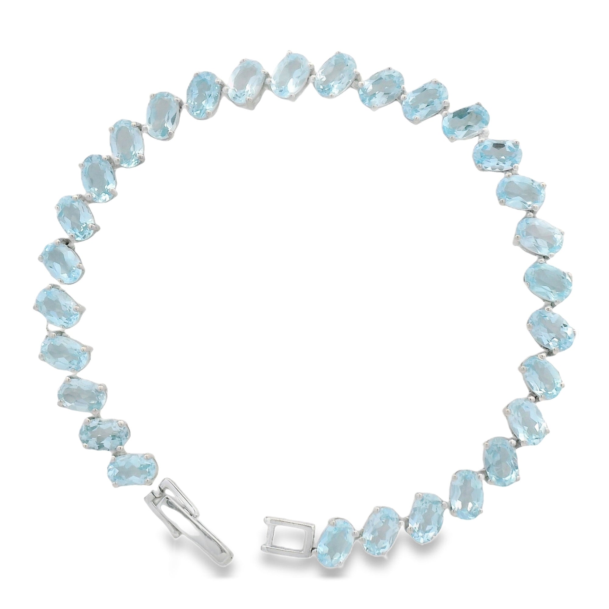 Pulsera Piedra Preciosa Óvalo Topacio Azul Plata .925 con Baño de Rodio.